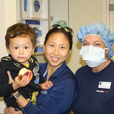 Surgeon with baby and doughnut