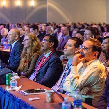 Crowd of attendees looking up at the stage of the ASCRS ASOA Annual Meeting