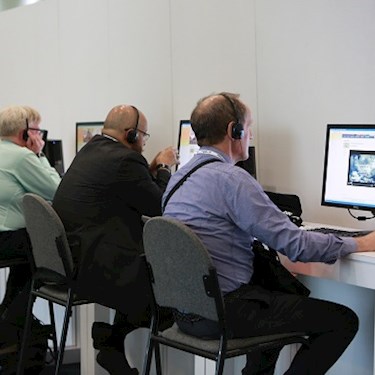 doctors listening to virtual meeting