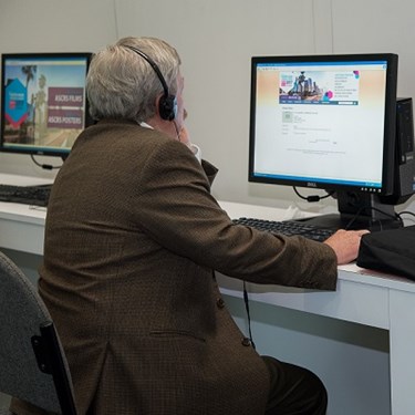 Doctor listening to virtual meeting